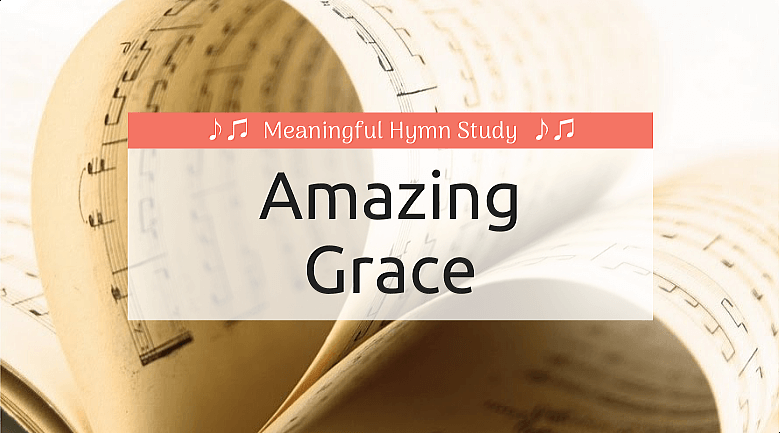 Music pages folded to make a heart; text overlay that says "Amazing Grace"