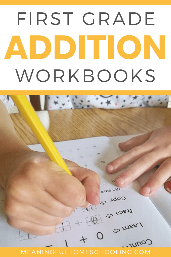 Child using pencil to trace math facts in addition workbook