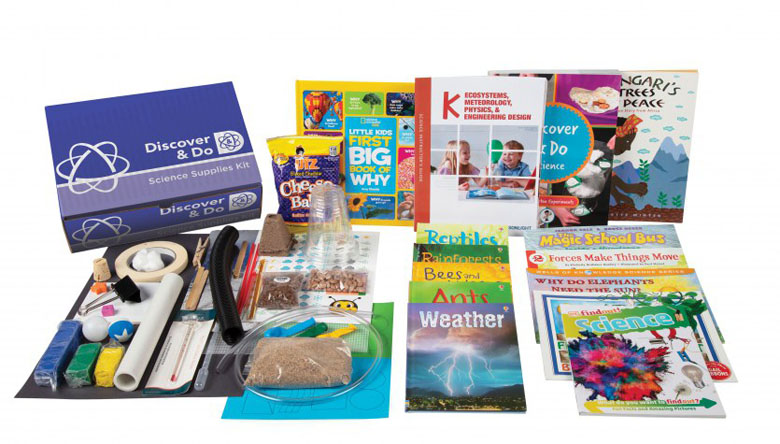 Science books and experiment kit on a white background