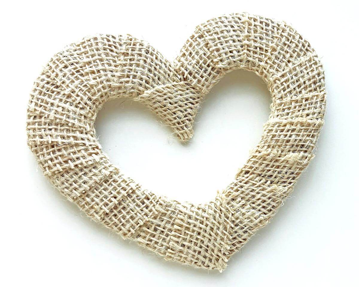 Image of a burlap-covered heart shape lying on a white background