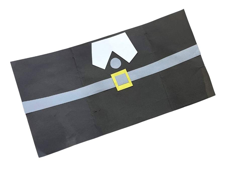 Image of pieces of construction paper in black, white, yellow, and gray.