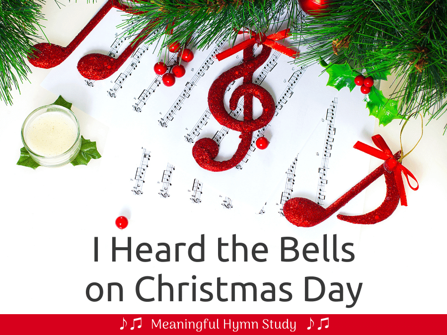 Christmas greenery with red music notes and sheet music on a white background; text overlay reads, "I Heard the Bells on Christmas Day"
