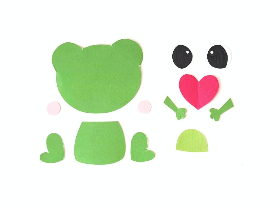 Image of cutout shapes to make a paper craft frog, all on a white background.