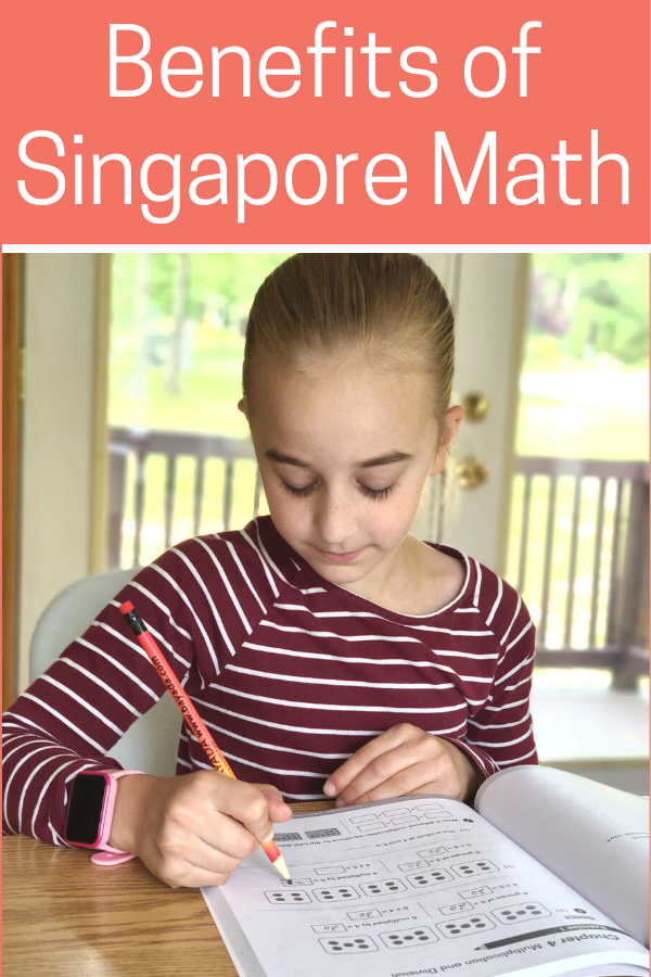 Image of young girl working in a Singapore math workbook.