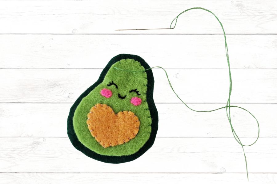 Basic sewing skills for kids Image of a felt avocado ready to be stitched together.