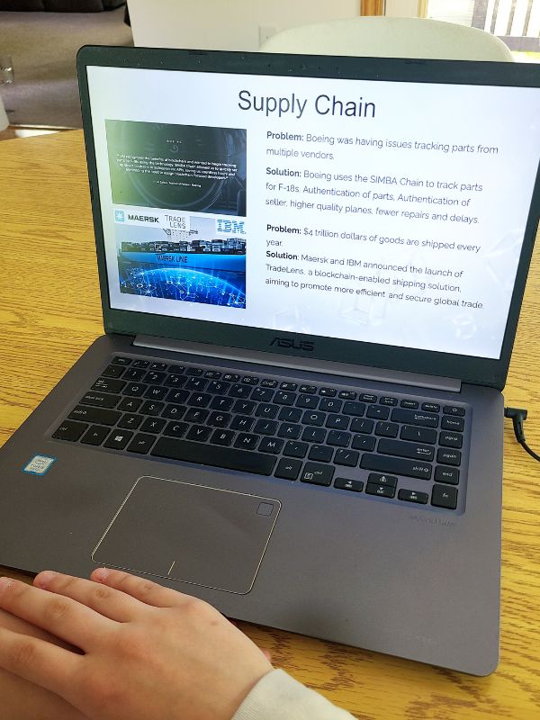 Blockchain for high school students Image of laptop with screen showing a video lesson.